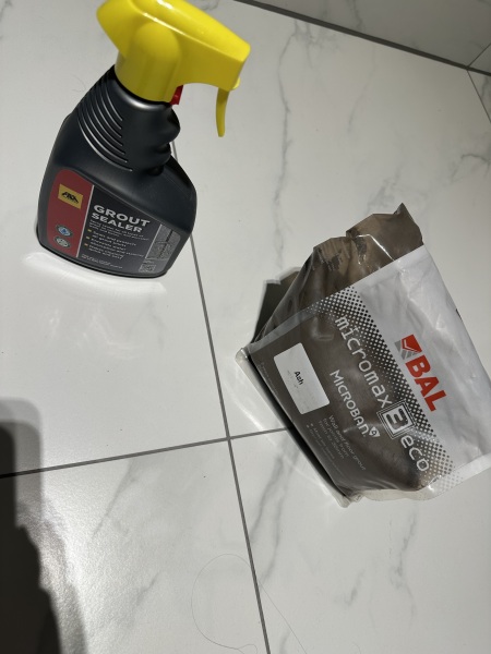 Bathroom: sealant over grouting?