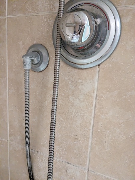 Pic included :how do I replace this please, shower hose