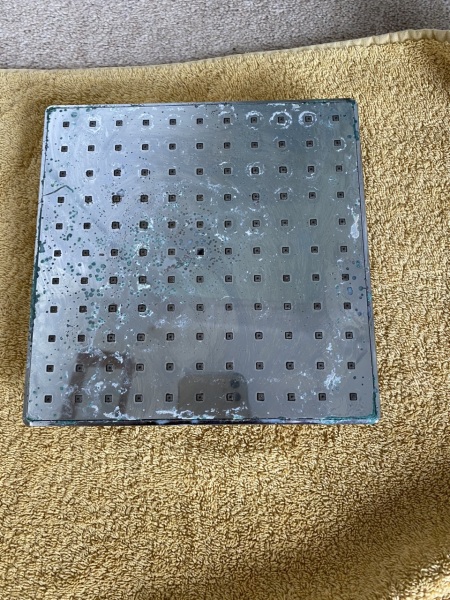 How do I clean this shower head?