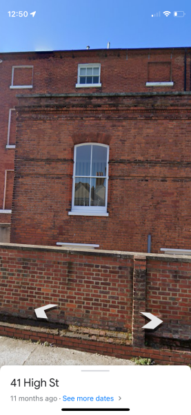 Kate in car with face turned away