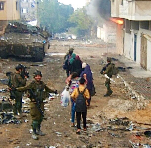 This picture of Israeli soldiers smiling for a selfie in front of a destroyed Gaza...