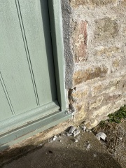 Pointing around door frame