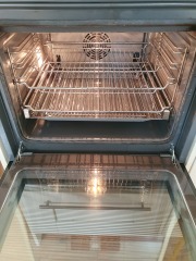 Cleaning baked on oven grease