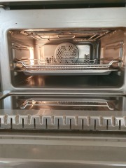 Cleaning baked on oven grease