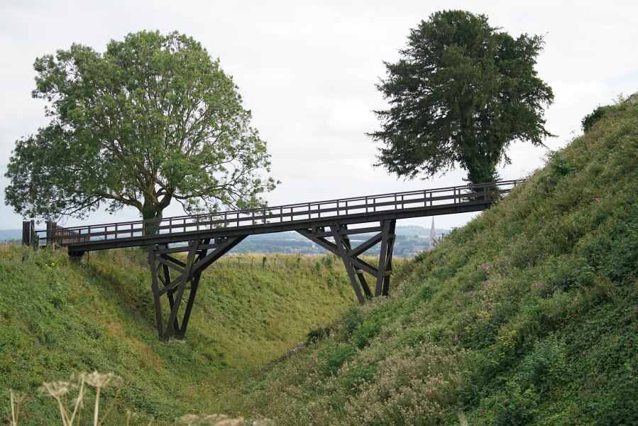 Sitting baby on edge of bridge