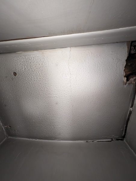 Hot water cylinder cupboard now empty, but new pipes in use