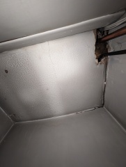 Hot water cylinder cupboard now empty, but new pipes in use