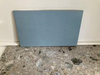 Which paint colour in a bathroom with blue-grey tiles?