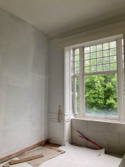 Wall panelling - continue in a small space in a corner or not?