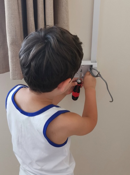 Neighbour allowing boy to use lawn mower