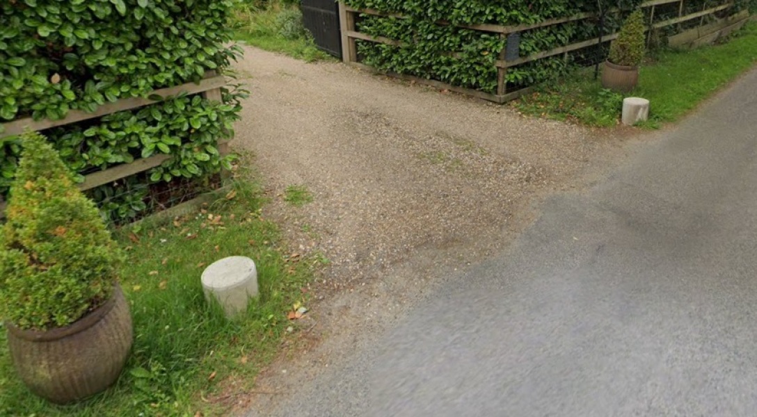 To put spikes in my front driveway flower bed.