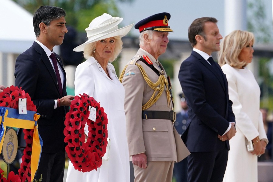 Sunak leaving D Day ceremony for a TV Interview