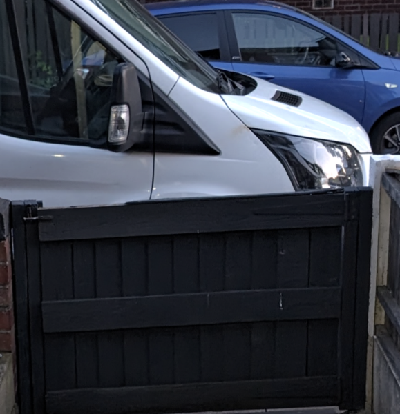 Vans parking outside my front gate on the pavement