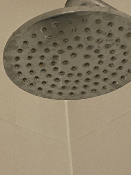Cleaning a waterfall shower head