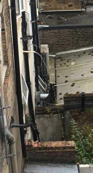 Neighbour's waste water discharging directly onto the ground