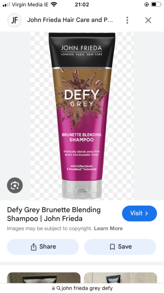 Grey strands of hair at front