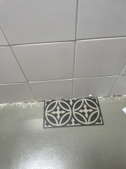 Wrong patterned flooring in small bathroom?