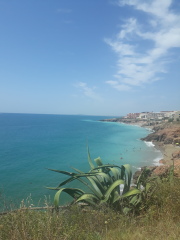Where might we choose to holiday if we like sunny old towns, cafe culture, markets and white beaches.