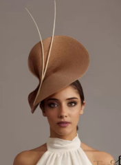 MN has spoken, fascinators are awful, wide headbands are OK, your thoughts on this one please