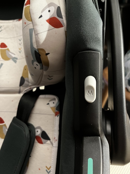 Cosatto car seat - what does the M button do? (Photo)