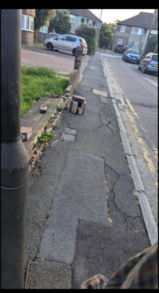 Can I report fallen wall to council?