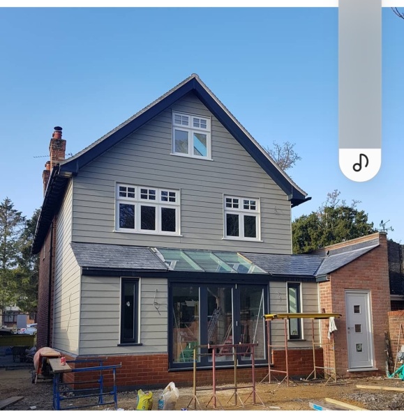 Hipped roof at the front of the house, gable at the back - does it look odd?