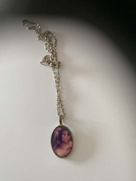 Who is the man in the necklace?