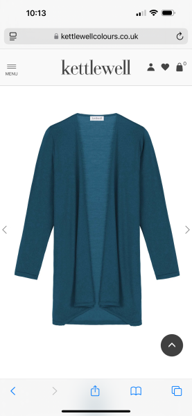 Cardigan nipped in at waist, flared over hips