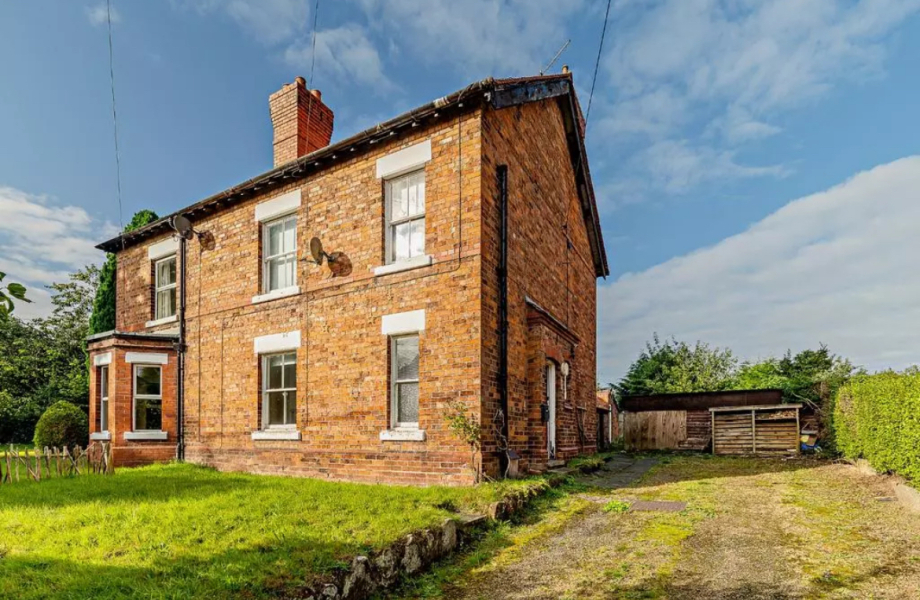 Hipped roof at the front of the house, gable at the back - does it look odd?