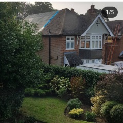 Hipped roof at the front of the house, gable at the back - does it look odd?