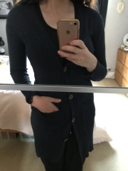 Cardigan nipped in at waist, flared over hips