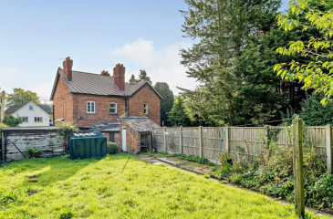Hipped roof at the front of the house, gable at the back - does it look odd?
