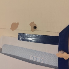 Drilling holes in an internal concrete wall for wall plugs and shelves