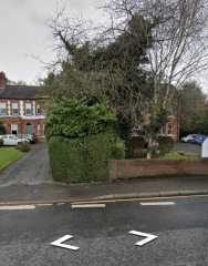 House on busy road beside offices?