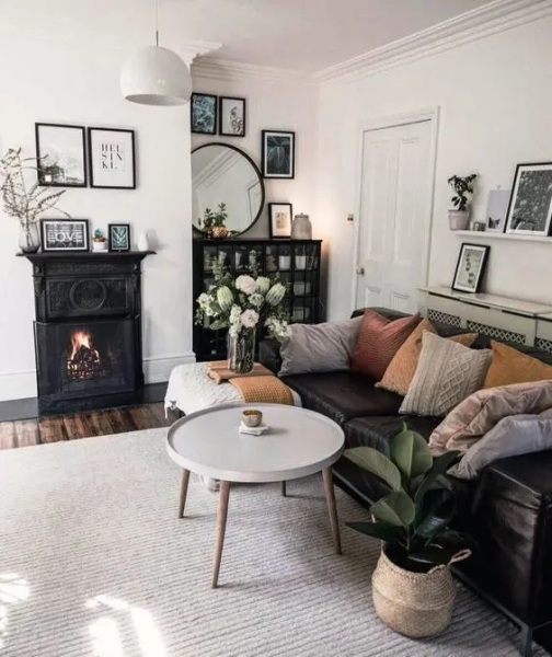 How can I have a cosy but tasteful living room when I have a black leather sofa?