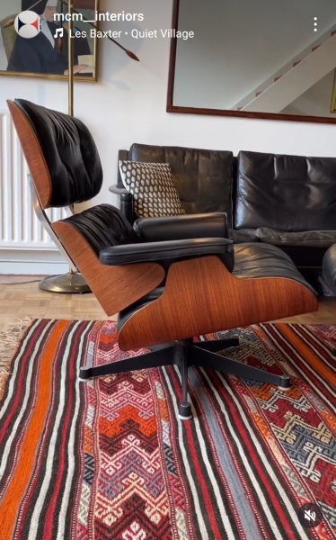 How can I have a cosy but tasteful living room when I have a black leather sofa?