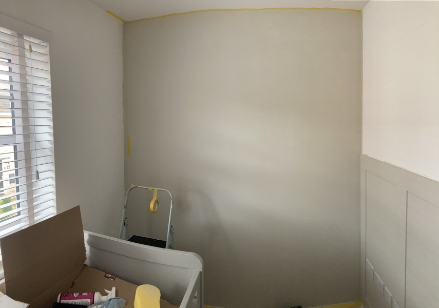 Leave one wall white or paint everywhere?
