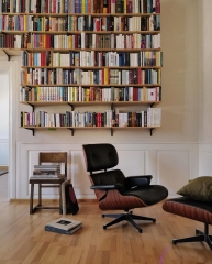 How can I have a cosy but tasteful living room when I have a black leather sofa?