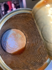 Beans tin black inside, aibu to eat the contents?