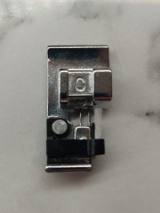Does anyone have this Janome overedge presser foot?