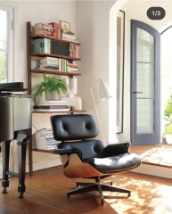 How can I have a cosy but tasteful living room when I have a black leather sofa?