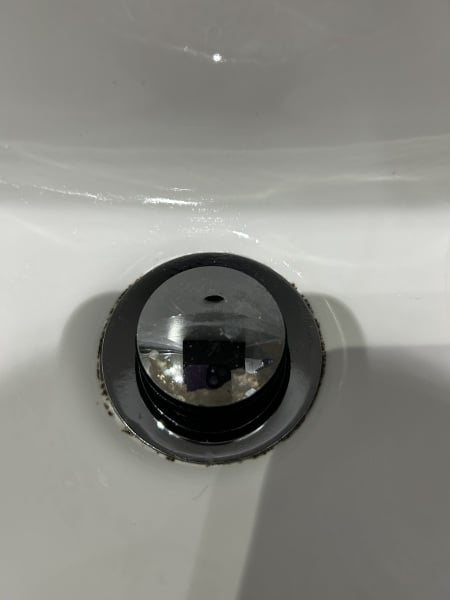 How do I clean this part of my sink?