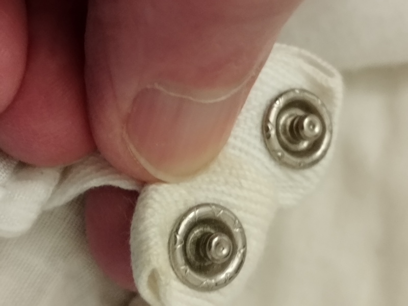 Trying to combine two summer duvets to make winter duvet but both have the same half of a clothes fastener?