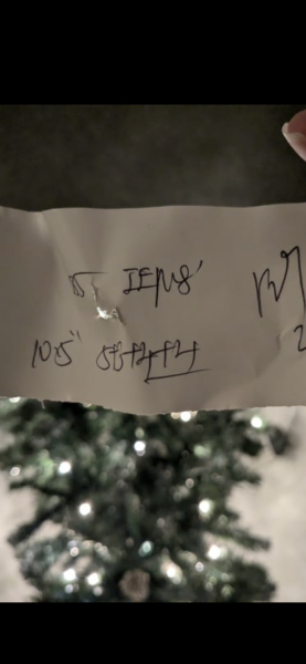 What does this say? It was fixed to my Christmas tree