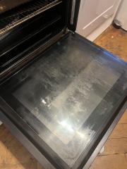 How to clean cloudy scum marks from my oven door?