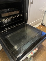 How to clean cloudy scum marks from my oven door?