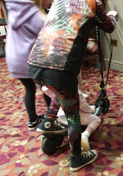 Kids on scooter in pub!