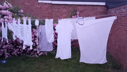Putting washing on the line in the sun