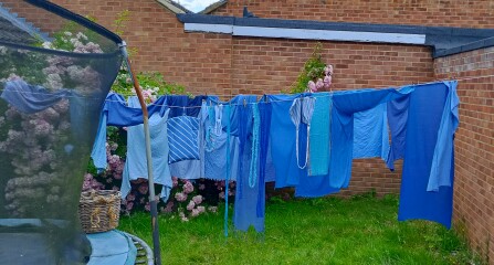 Putting washing on the line in the sun