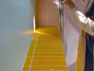 Fully tiled bathroom, what can I put over the tiles?